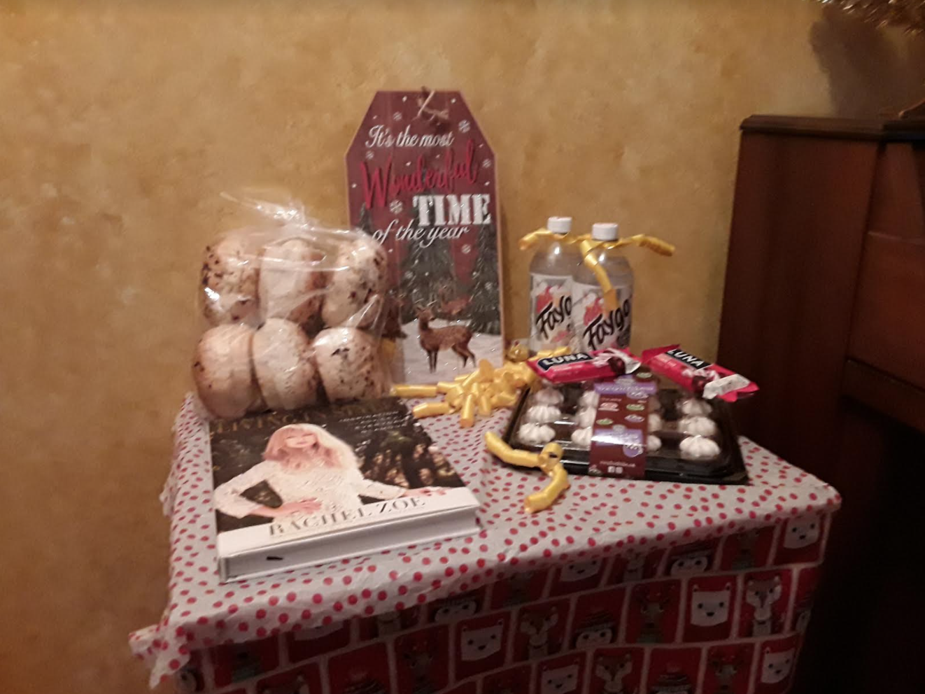 Small table with holiday table cloth and holiday themed items